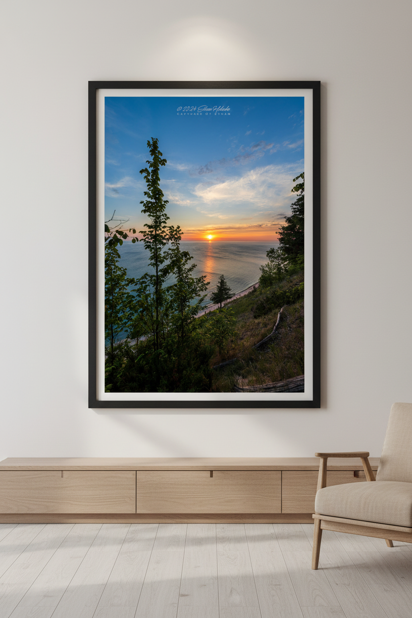 Large fine art portrait print of a vibrant sunset over Lake Michigan viewed through trees from Empire Bluffs at Sleeping Bear Dunes displayed in modern living room