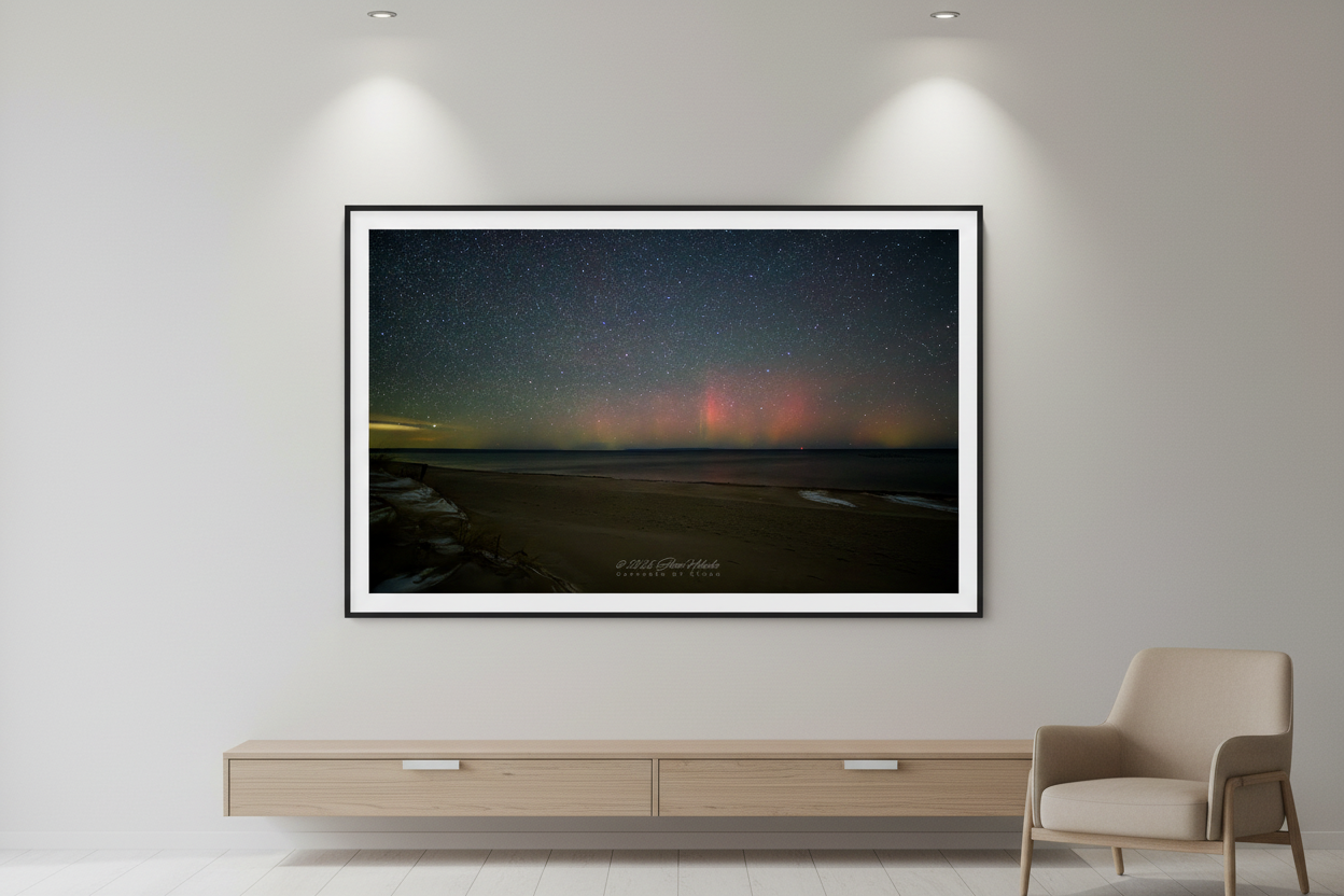 Large fine art print of northern lights aurora borealis over Glen Haven beach displayed in modern living room