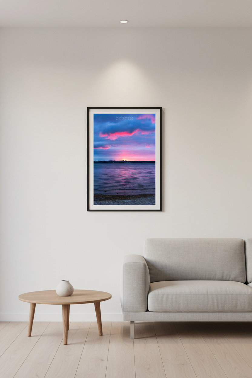 Small fine art portrait print of a vibrant pink and blue sunrise over West Grand Traverse Bay looking toward Old Mission Peninsula displayed in modern living room