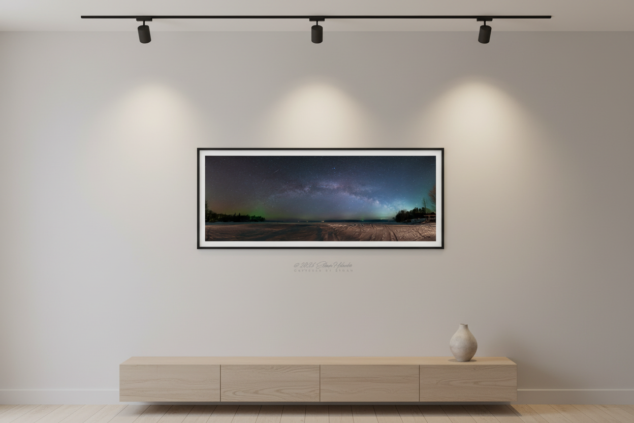 Small fine art panoramic print of Milky Way arch over frozen Lake Leelanau displayed in modern living room