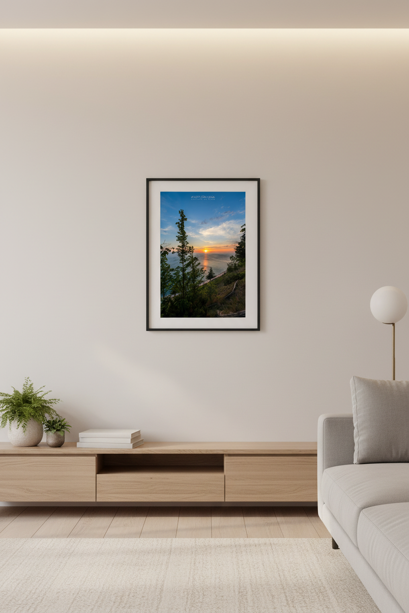 Small fine art portrait print of a vibrant sunset over Lake Michigan viewed through trees from Empire Bluffs at Sleeping Bear Dunes displayed in modern living room