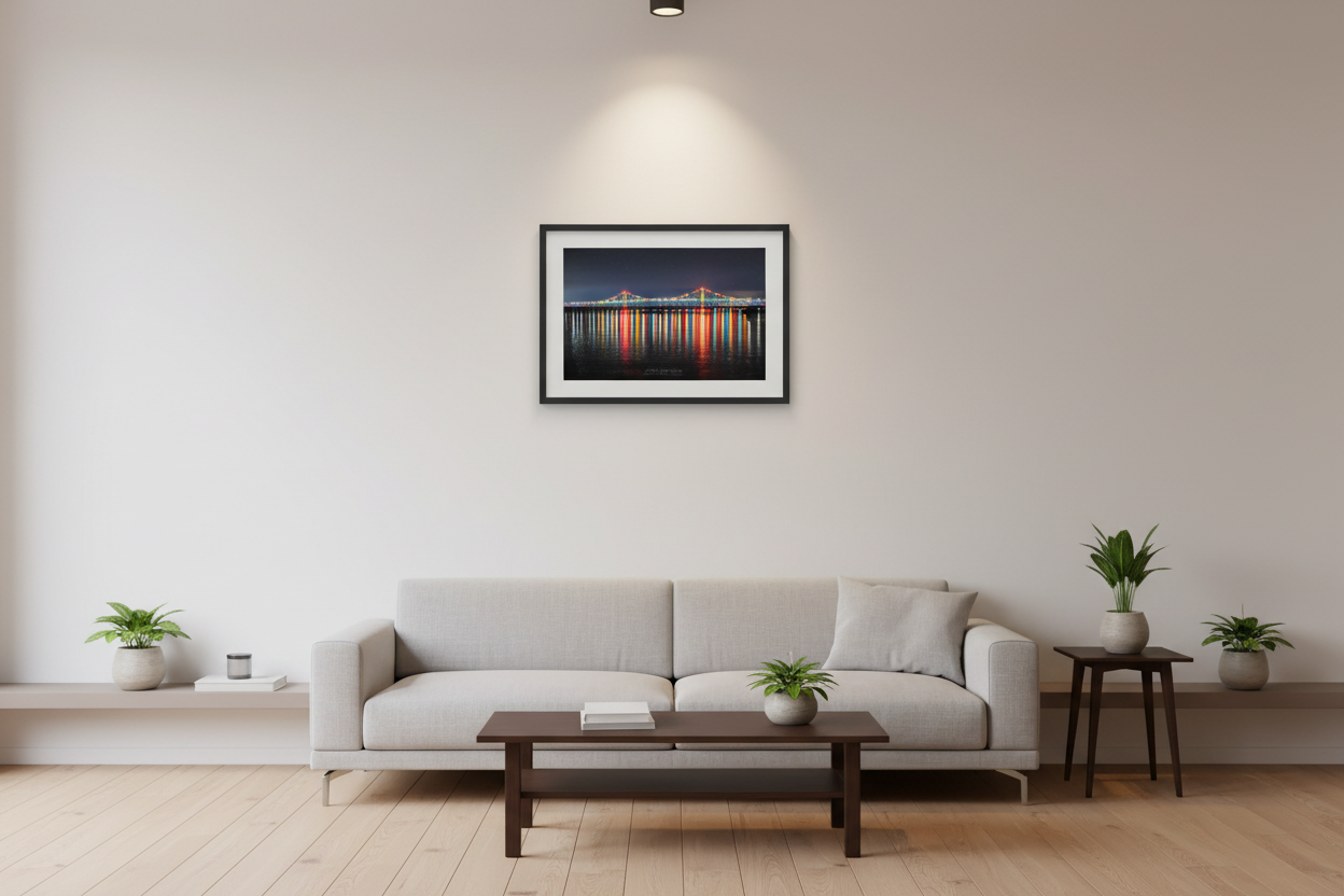 Small fine art landscape print of illuminated Mackinac Bridge at night displayed in modern living room